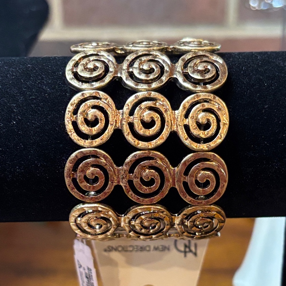 New Directions Gold Toned Swirl Bracelet size 7 1/2 stretch bracelet